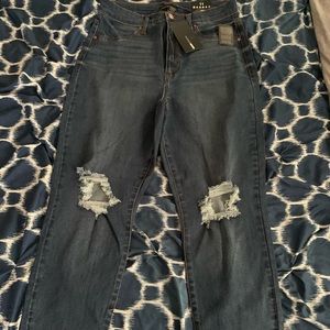 Brand new Fashion Nova shredded knee jeans